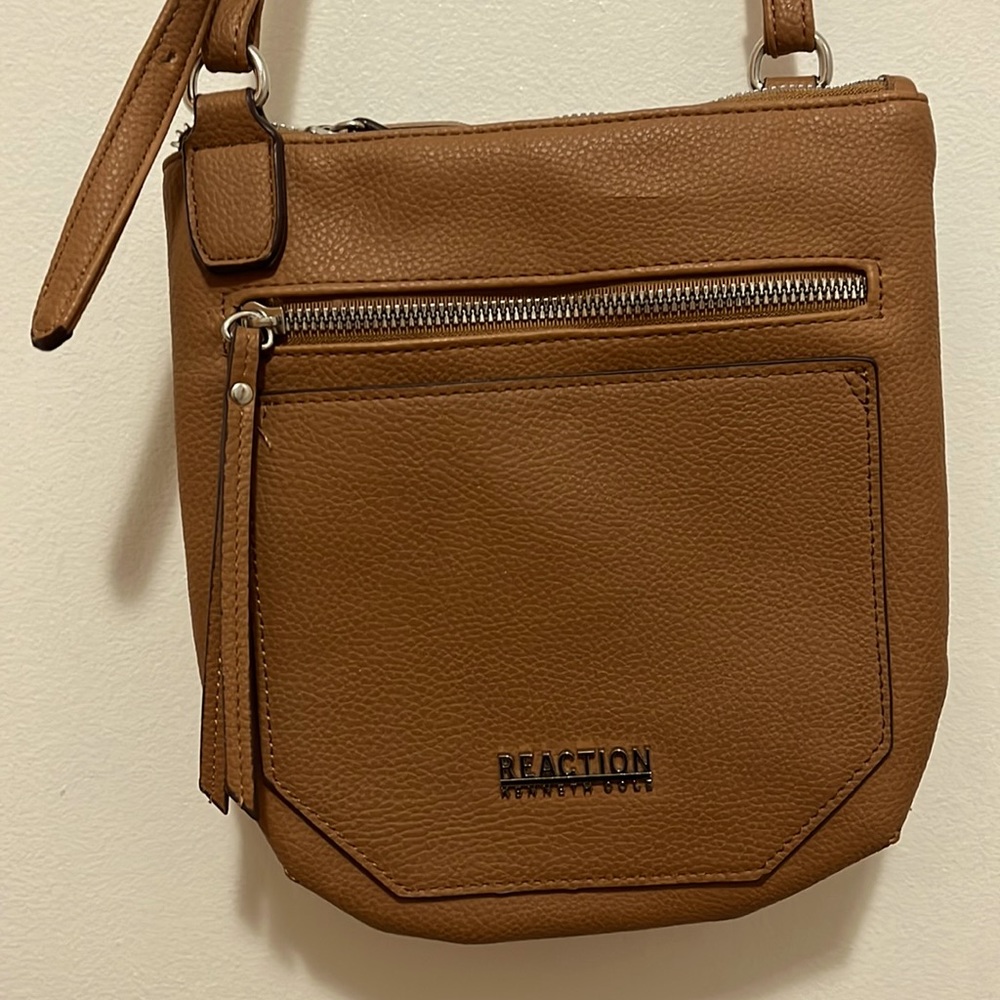 Crossbody. Adjustable strap. Carried about 3 times. No tears/stains/holes.